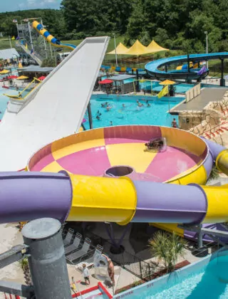 Aerial of colorful waterpark slide.
