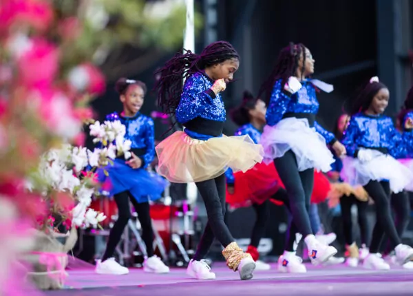 Group of young girls dance on stage at Azalea Festival.